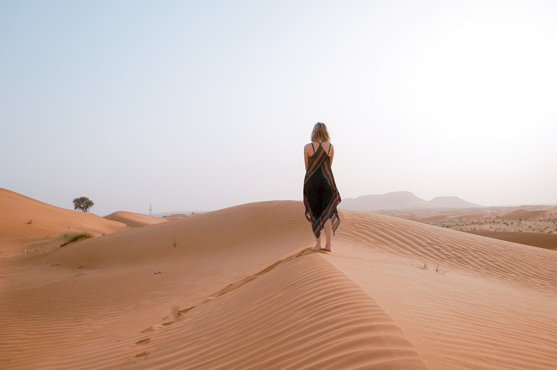 Woman Walking on Sand Dunes